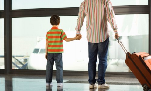 Boy With Father at Airport Terminal